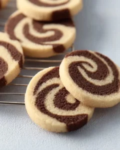 Freshly baked Chocolate Vanilla Swirl Cookies on a cooling rack